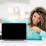 Happy Nurse Coach Pointing To Her Sacred Virtual Space Computer Screen