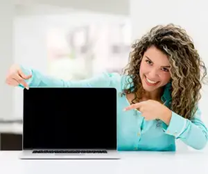 Happy Nurse Coach pointing to her Sacred Virtual Space computer screen