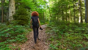 Physical Activity Hiking Woman In Green Forest
